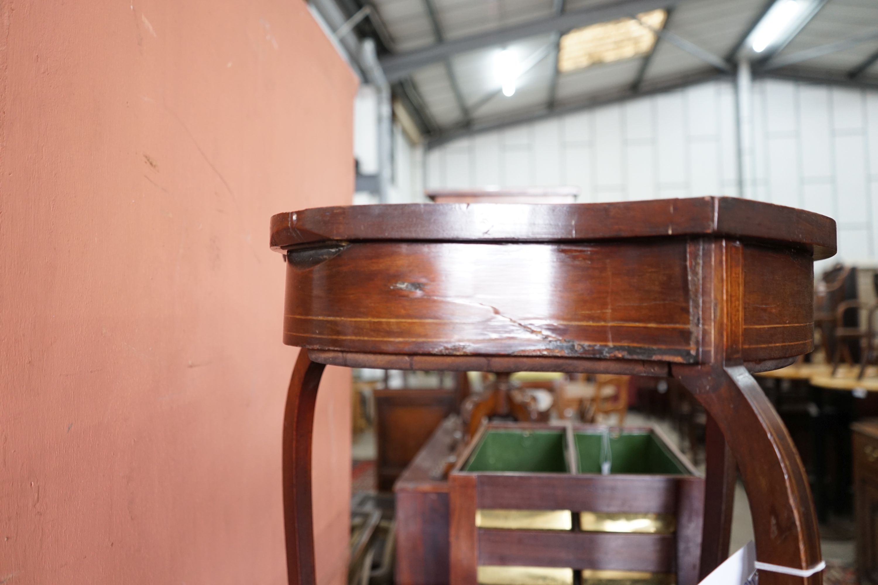 An Edwardian mahogany shield shaped bijouterie table, width 50cm, depth 59cm, height 72cm